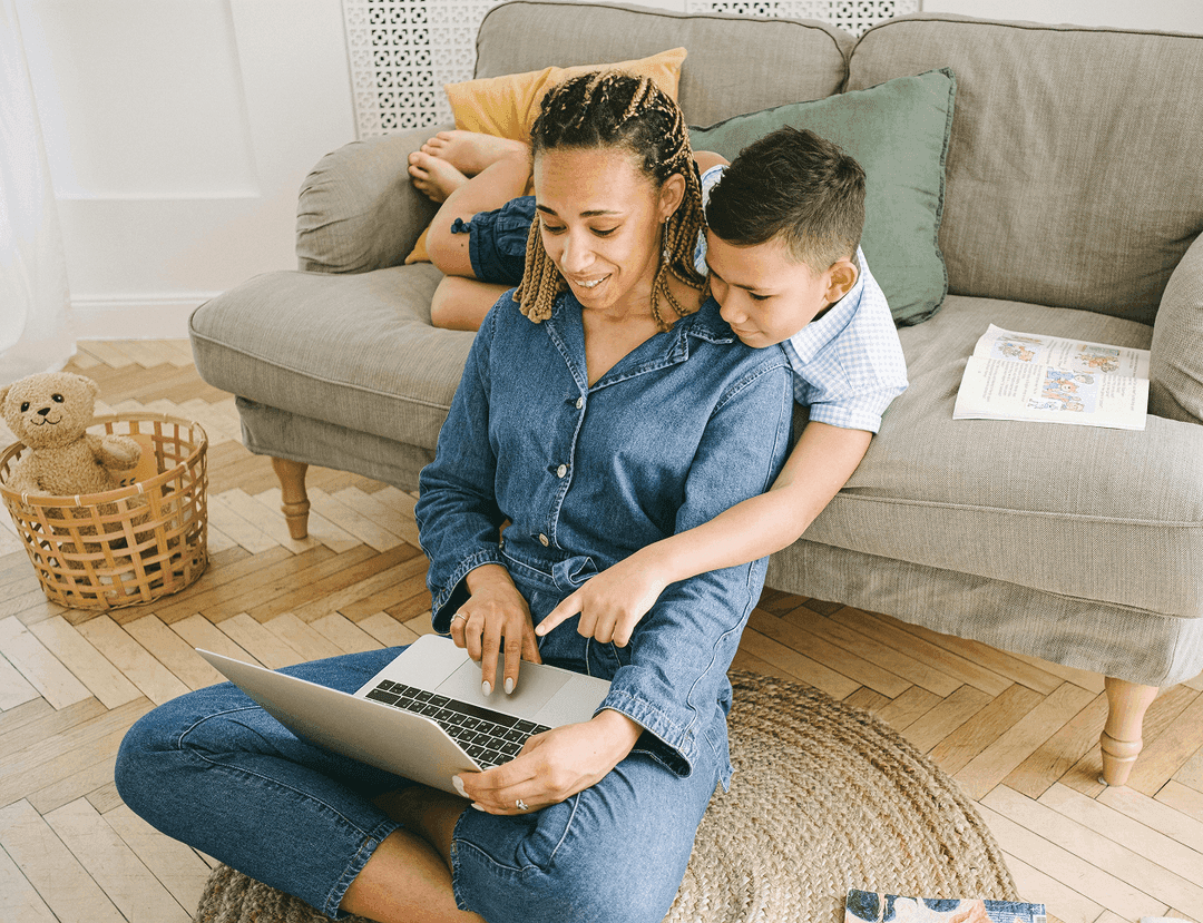 A parent working with their child nearby